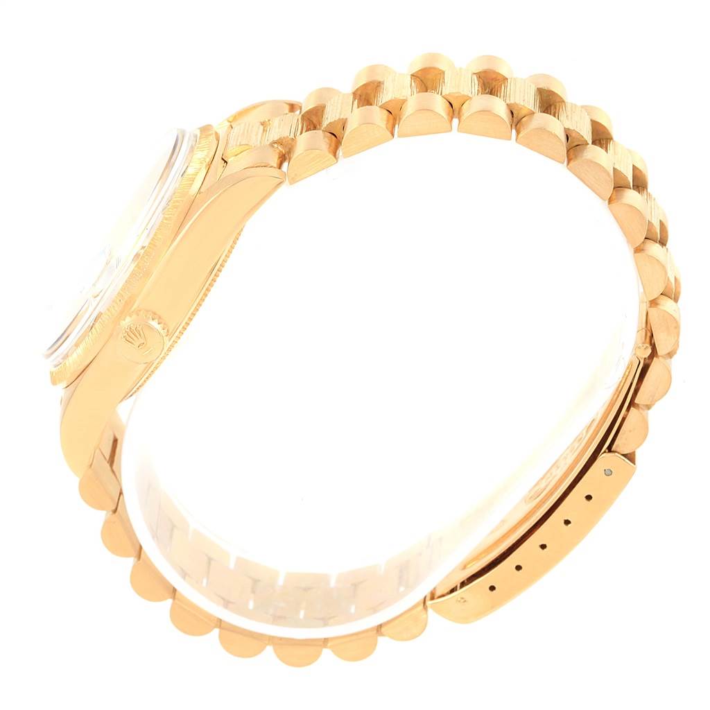 The image shows a side view of the Rolex President 1807 Men's Yellow Gold Silver Dial 1807 Men's Yellow Gold Silver Dial model watch, highlighting its gold bracelet and case with the crown logo visible.