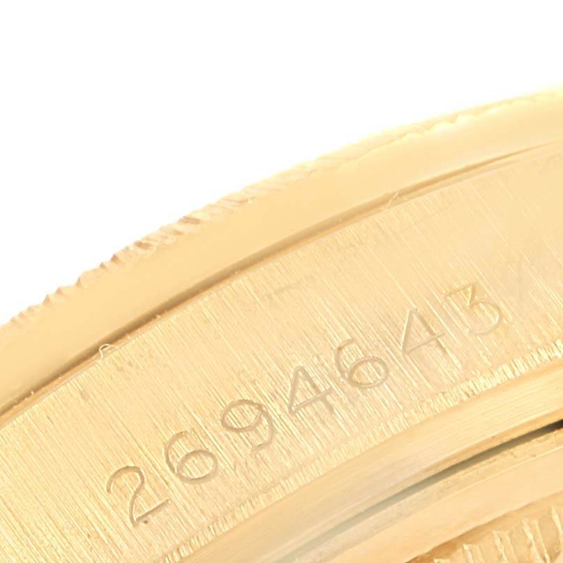 This close-up image shows the side view of the bezel on a Rolex President 1807 Men's Yellow Gold Silver Dial 1807 Men's Yellow Gold Silver Dial model watch.