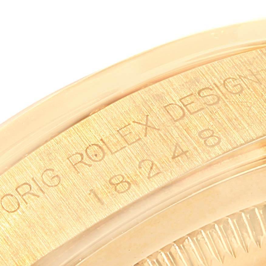 This image shows a close-up of the engraved case back edge of a Rolex President 18248 Men
s Yellow Gold White Dial 18248 Men
s Yellow Gold White Dial watch.