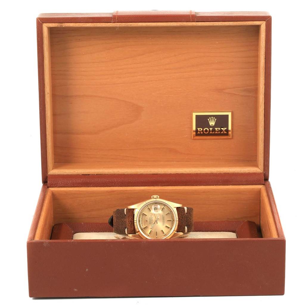 The Rolex President 18248 Men's Yellow Gold Champagne Dial 18248 Men's Yellow Gold Champagne Dial model watch is shown from the front, displayed inside its open wooden box with the Rolex logo.