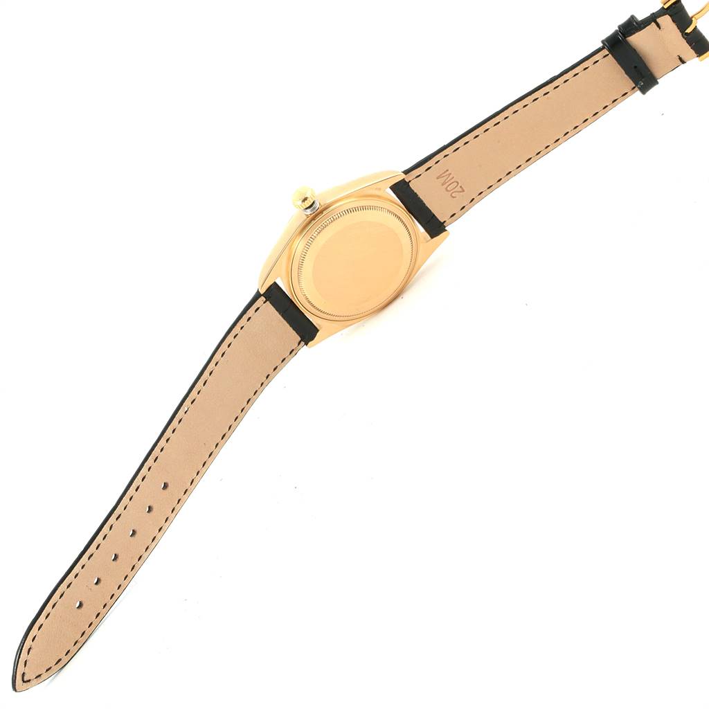 This image shows the back of a Rolex President 18038 Men
s Yellow Gold Beige Dial 18038 Men
s Yellow Gold Beige Dial model watch, focusing on the case back and leather strap.