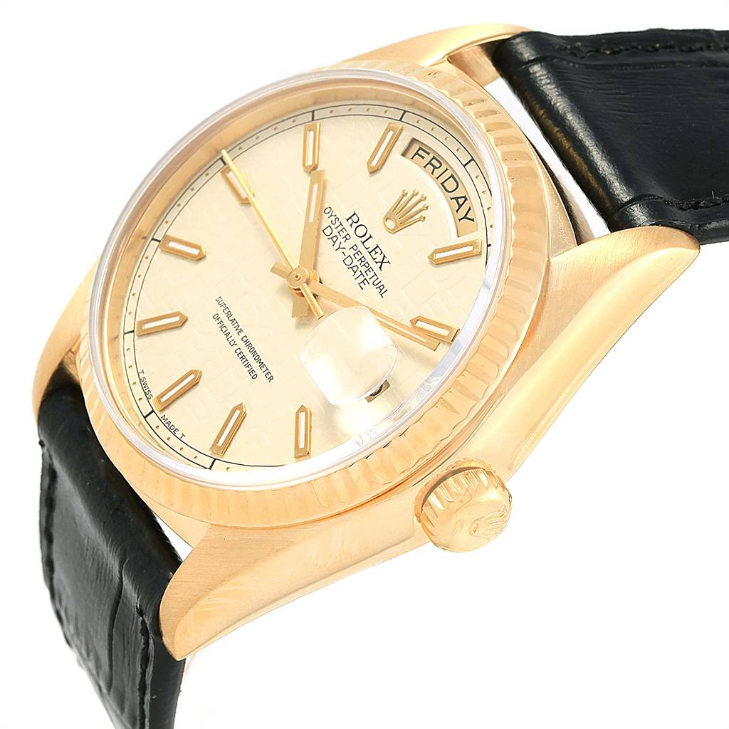 This photo shows the Rolex President 18038 Men
s Yellow Gold Beige Dial 18038 Men
s Yellow Gold Beige Dial model watch from an angled side view, highlighting the dial, crown, bezel, and part of the strap.