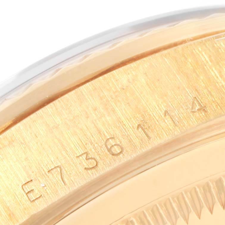 This is a close-up angle showing the serial number engraving on the case of a Rolex President 18238 Men's Yellow Gold Black Dial 18238 Men's Yellow Gold Black Dial model.
