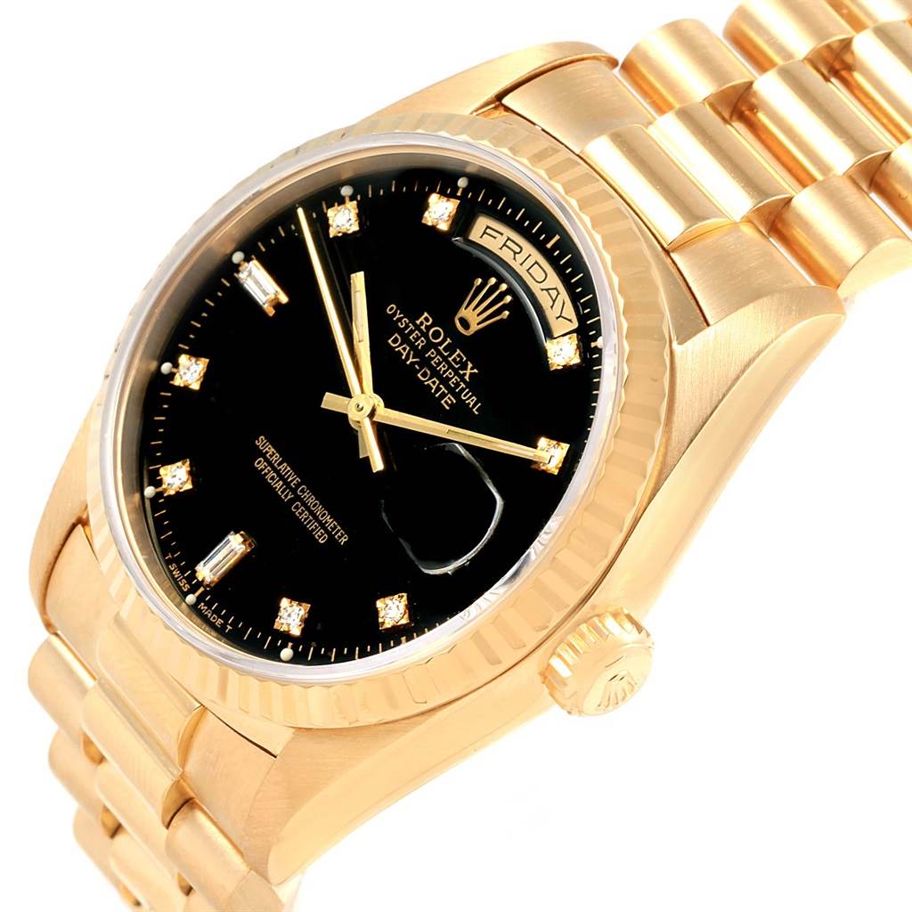 This image shows a close-up view of a Rolex President 18238 Men's Yellow Gold Black Dial 18238 Men's Yellow Gold Black Dial model, highlighting the black dial, day-date display, and gold bracelet.
