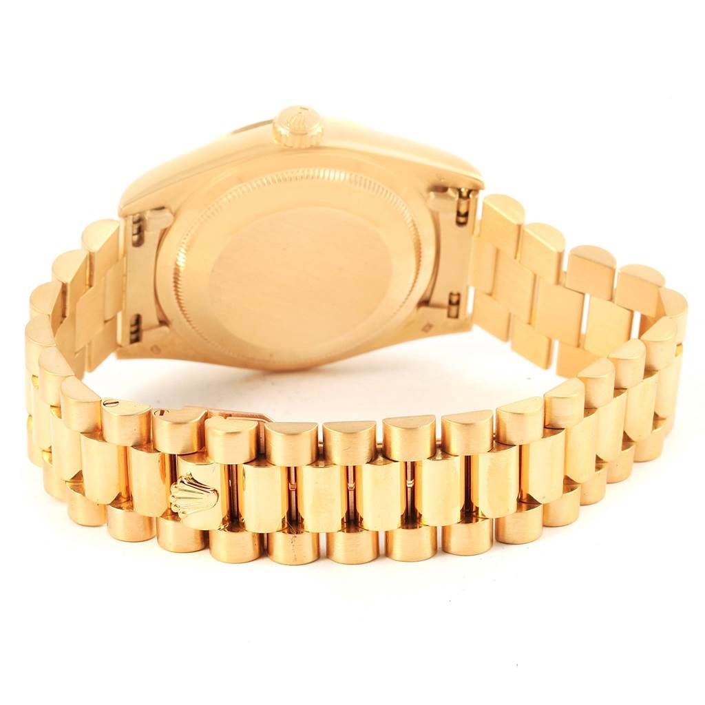 This image shows the back case and bracelet of a Rolex President 18238 Men's Yellow Gold Black Dial 18238 Men's Yellow Gold Black Dial model watch, highlighting its gold finish and clasp.