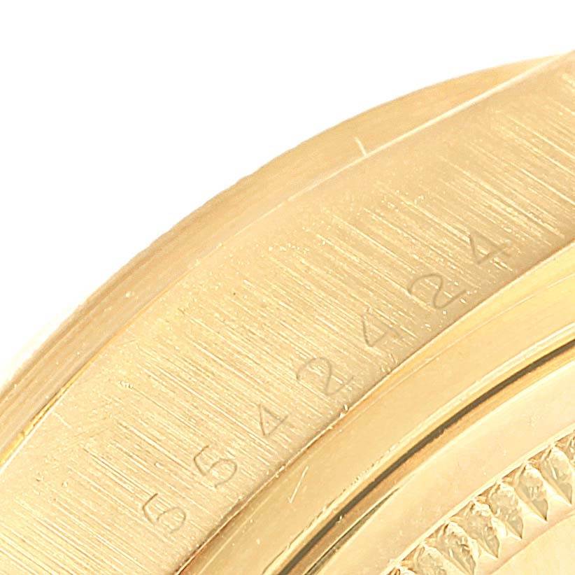This close-up image shows the engraved serial number on the gold case side of a Rolex President 18078 Men's Yellow Gold White Dial 18078 Men's Yellow Gold White Dial model.