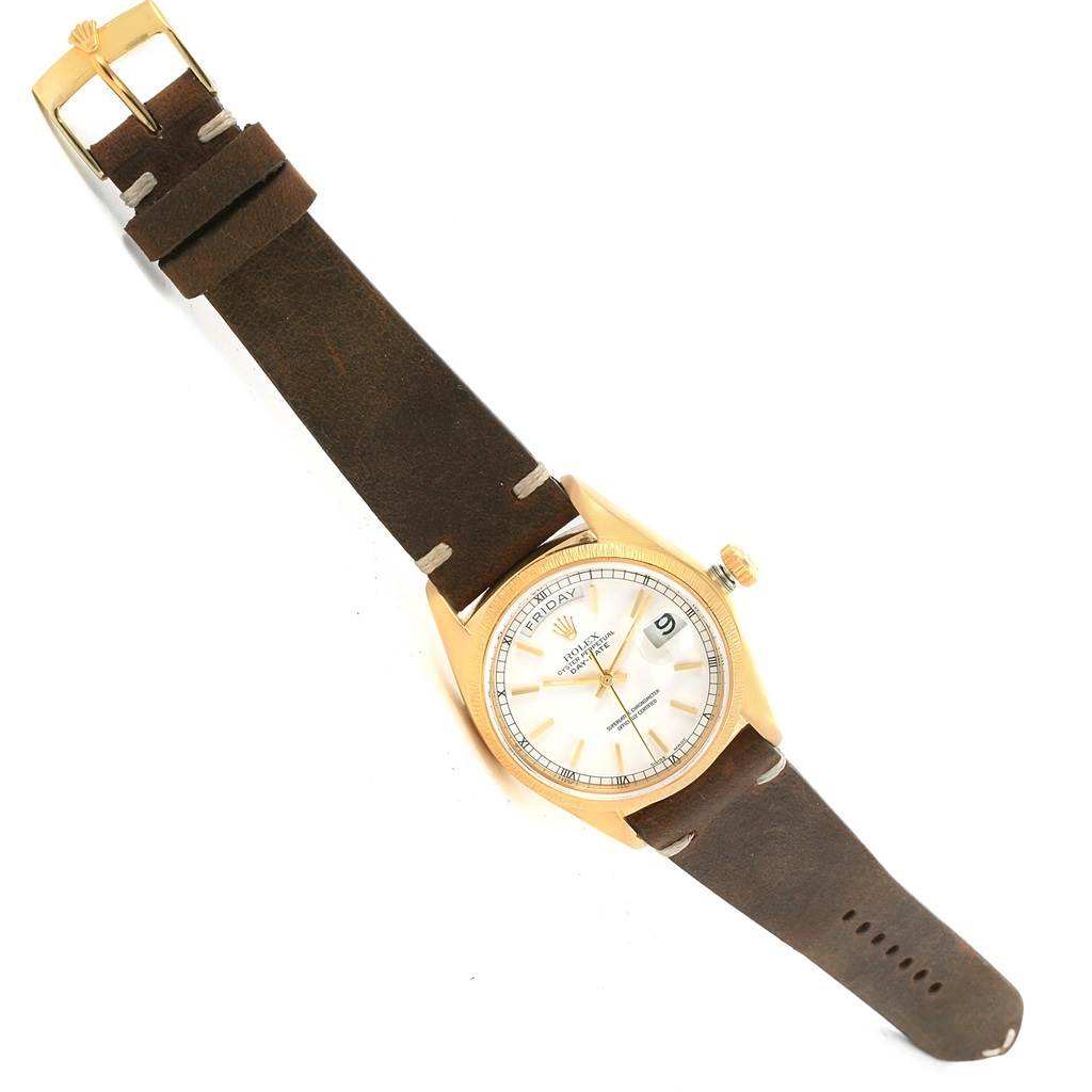 The image shows a top-down view of a Rolex President 18078 Men's Yellow Gold White Dial 18078 Men's Yellow Gold White Dial model watch with a leather strap and gold bezel.