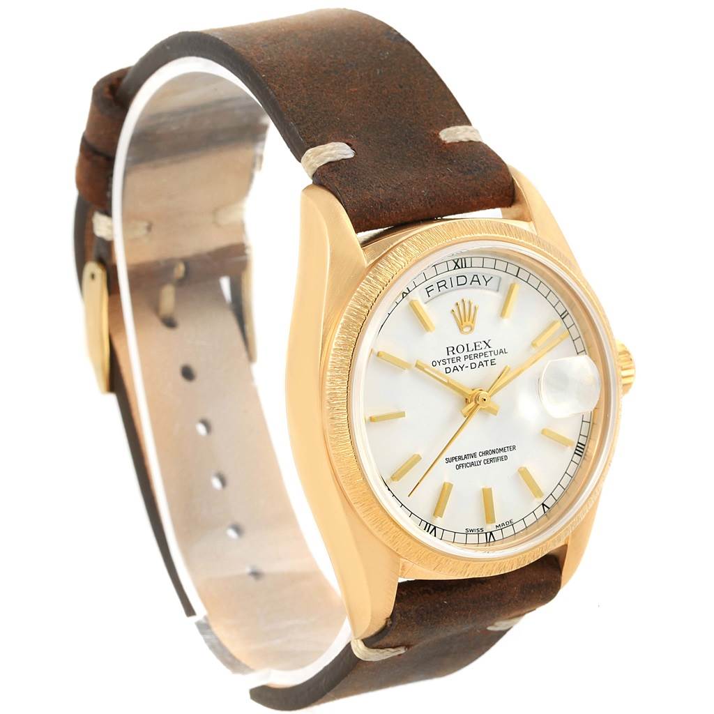 The image shows a Rolex President 18078 Men's Yellow Gold White Dial 18078 Men's Yellow Gold White Dial model watch from a side angle, displaying its face, bezel, case, crown, and leather strap.