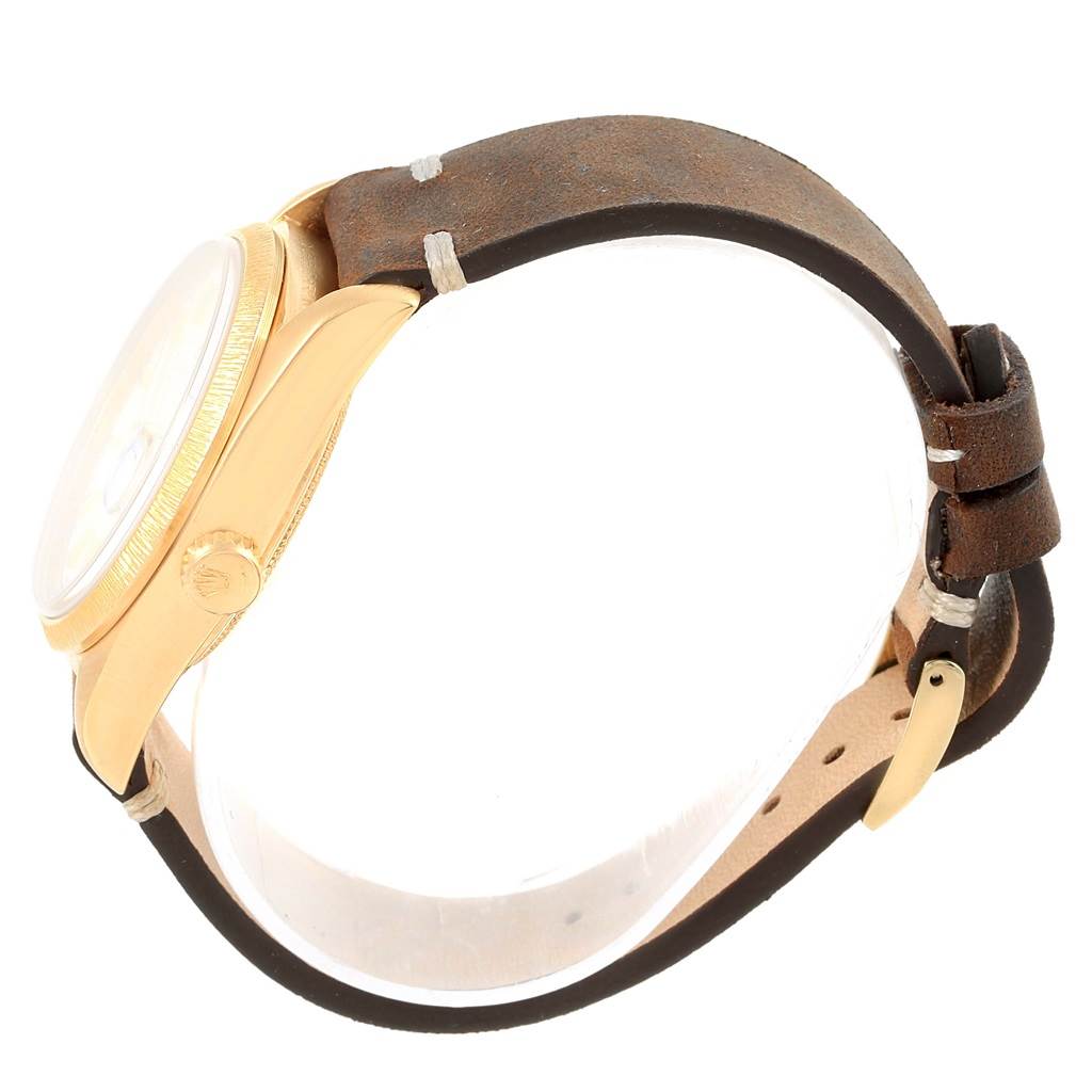 The image shows a side view of the Rolex President 18078 Men's Yellow Gold White Dial 18078 Men's Yellow Gold White Dial model watch, highlighting its crown, bezel, and leather strap.