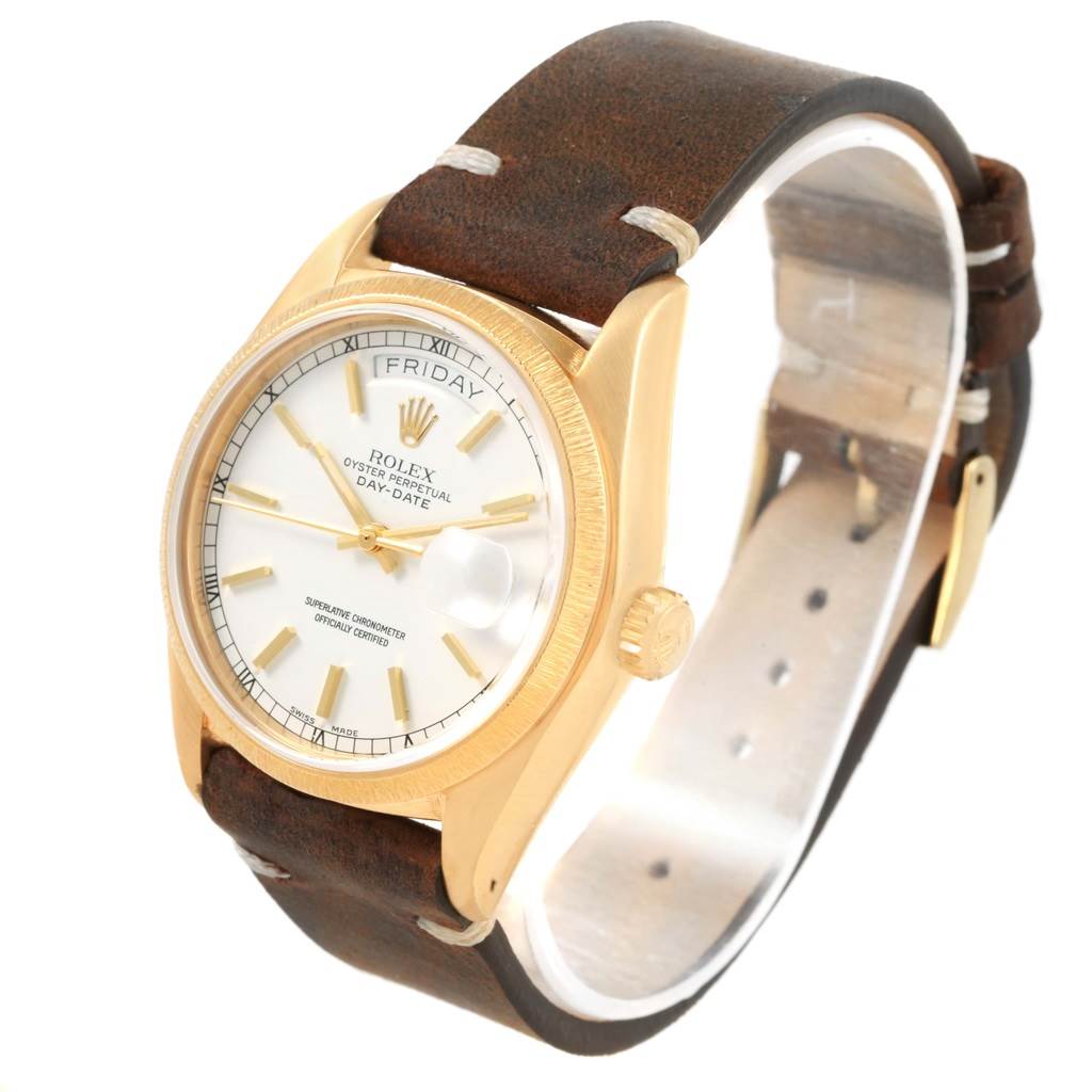 The image shows a Rolex President 18078 Men's Yellow Gold White Dial 18078 Men's Yellow Gold White Dial model watch at a slightly angled, top-down view, highlighting the dial, bezel, and leather strap.