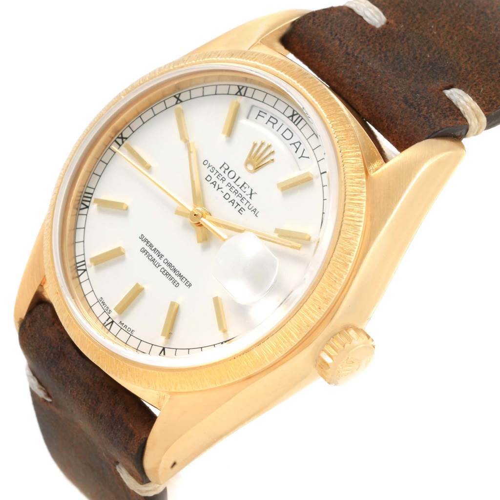 The Rolex President 18078 Men's Yellow Gold White Dial 18078 Men's Yellow Gold White Dial watch is shown at a slight angle displaying its face, bezel, and crown on a leather strap.