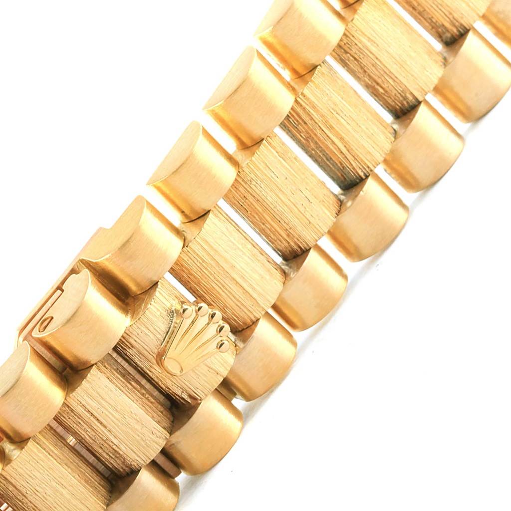 The image shows a close-up, angled shot of the gold bracelet of a Rolex President 18248 Men's Yellow Gold Champagne Dial 18248 Men's Yellow Gold Champagne Dial model watch.