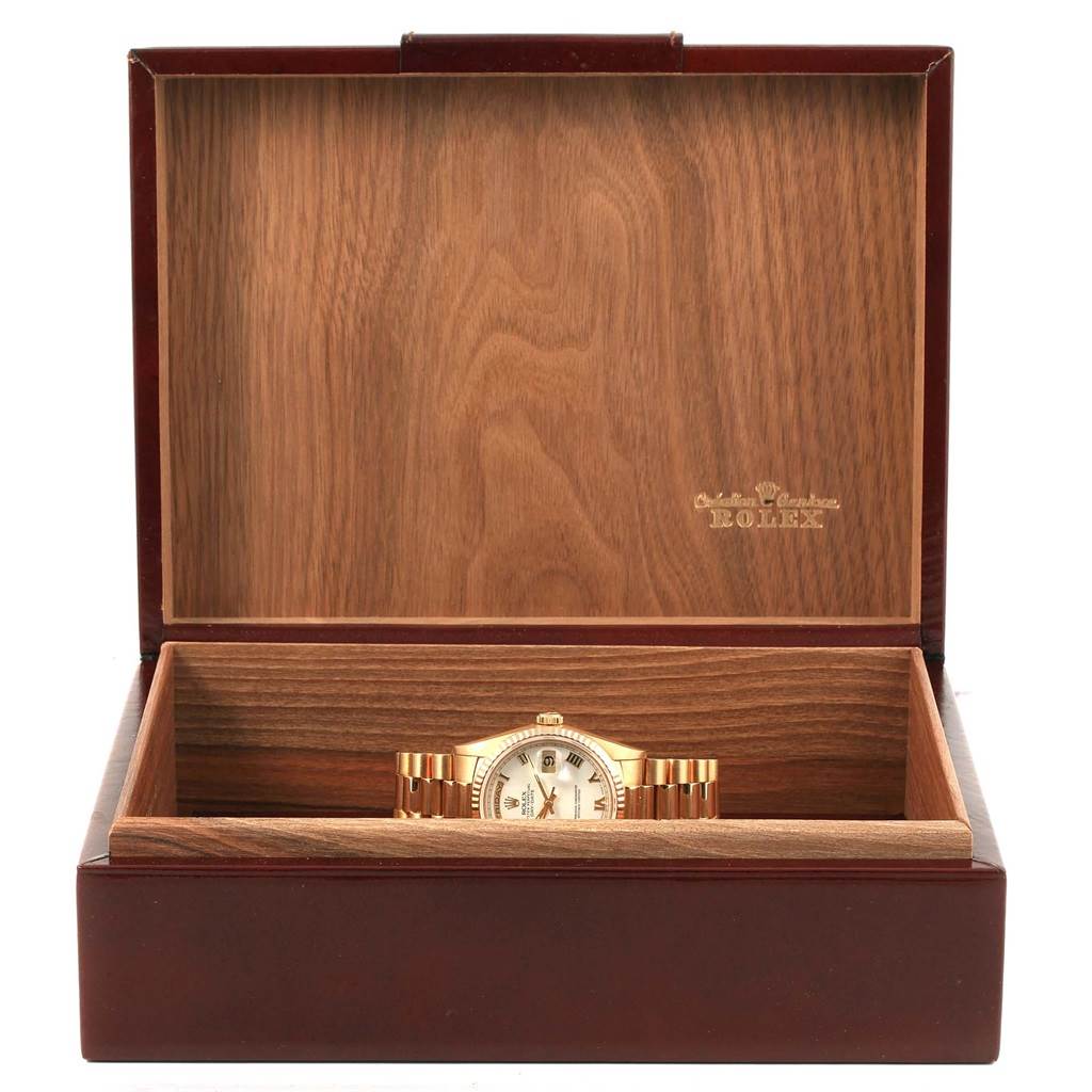 The Rolex President 18238 Men's Yellow Gold White Dial 18238 Men's Yellow Gold White Dial model watch is shown in its open presentation box, displaying the dial and bracelet.
