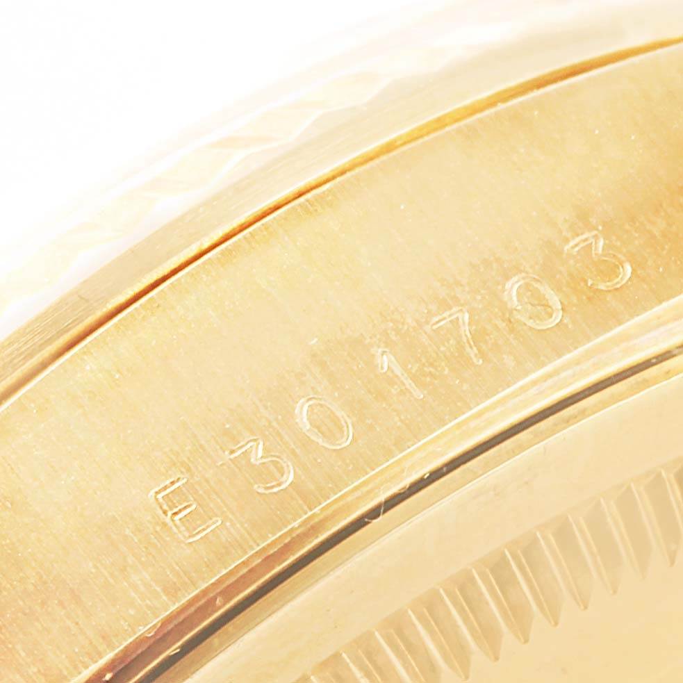 The image shows a close-up of the serial number engraved on the gold case of a Rolex President 18238 Men's Yellow Gold White Dial 18238 Men's Yellow Gold White Dial model watch.