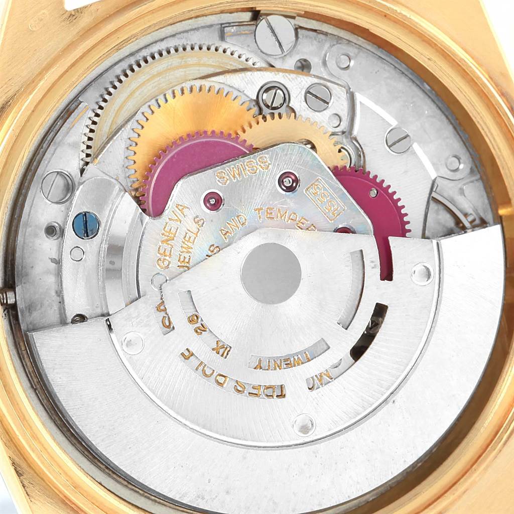 This image shows a close-up of the internal mechanism of the Rolex President 1803 Men's Yellow Gold Champagne Dial 1803 Men's Yellow Gold Champagne Dial model watch, highlighting its gears and components.