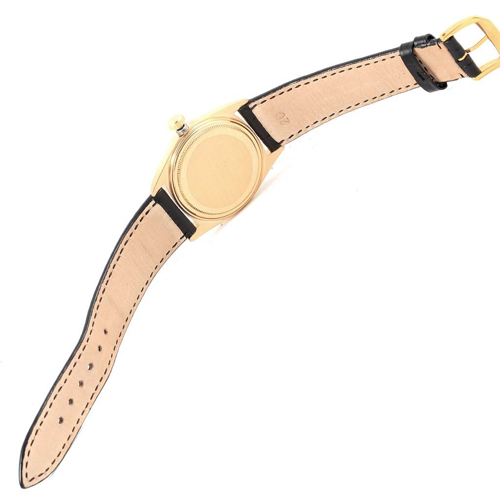 The image shows the back case and leather strap of a Rolex President 1803 Men's Yellow Gold Champagne Dial 1803 Men's Yellow Gold Champagne Dial model watch from a top-down angle.