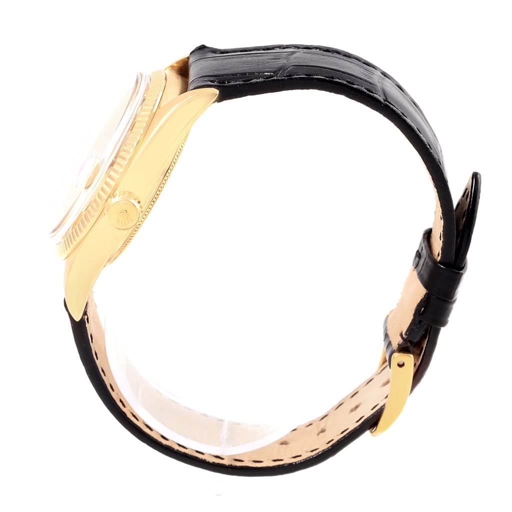 The image shows a side view of a Rolex President 1803 Men's Yellow Gold Champagne Dial 1803 Men's Yellow Gold Champagne Dial model watch, highlighting its gold case, black leather strap, and buckle.