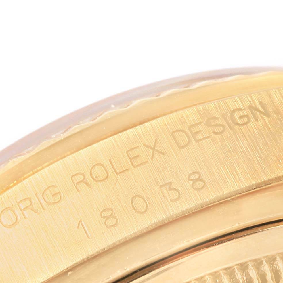 This close-up image shows the side, particularly the case and engravings, of the Rolex President 18038 Men's Yellow Gold Blue Dial 18038 Men's Yellow Gold Blue Dial watch model.