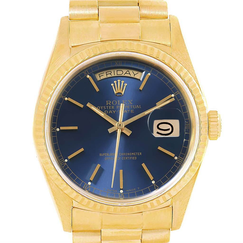 The image shows a frontal view of a Rolex President 18038 Men's Yellow Gold Blue Dial 18038 Men's Yellow Gold Blue Dial model watch with a gold case, bracelet, and blue dial displaying the day and date.
