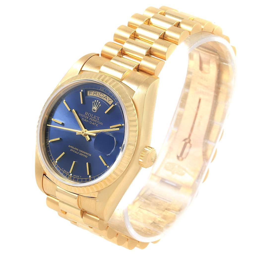 This image shows a side-angle view of the Rolex President 18038 Men's Yellow Gold Blue Dial 18038 Men's Yellow Gold Blue Dial model, highlighting the blue dial, gold bracelet, and watch crown.