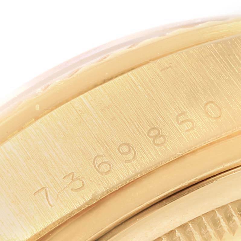 This image shows a close-up of the side of the Rolex President 18038 Men's Yellow Gold Blue Dial 18038 Men's Yellow Gold Blue Dial model, focusing on the serial number engraving.