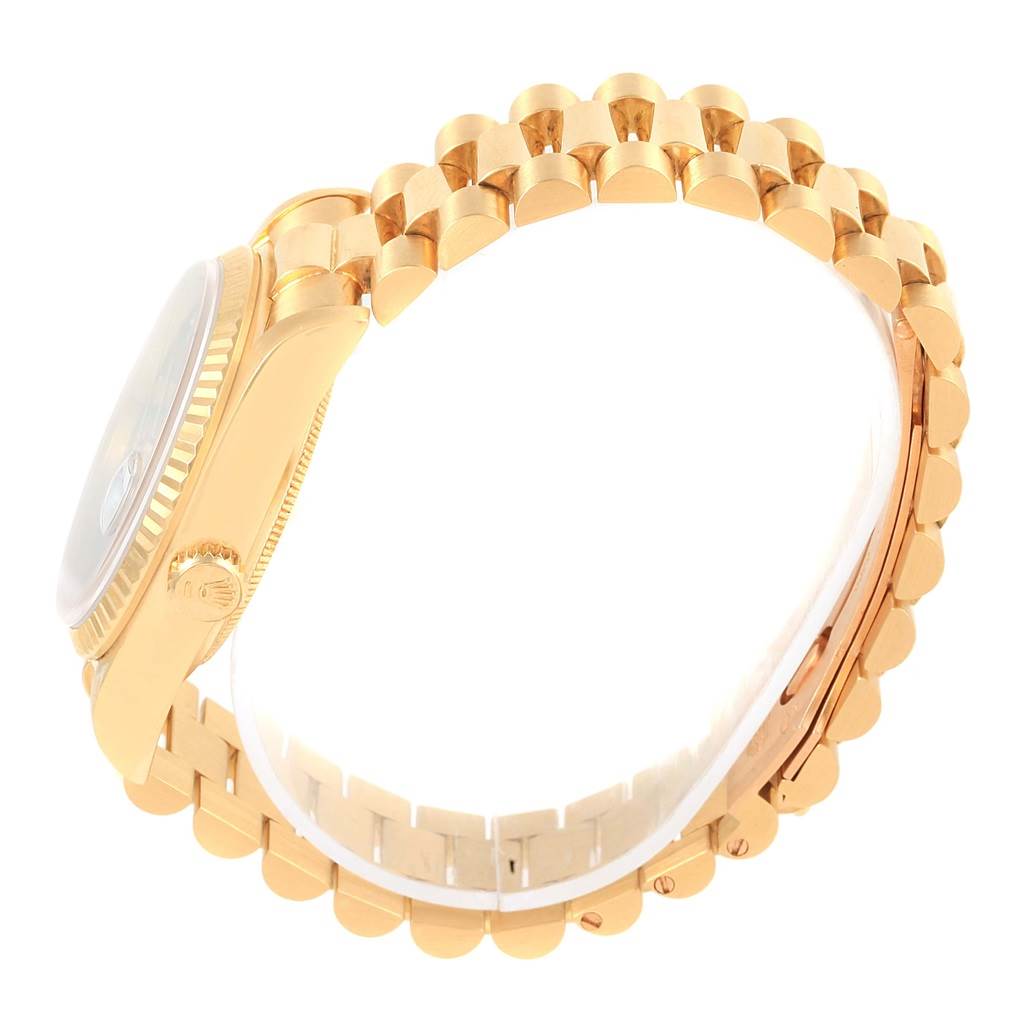 This image shows a side view of the Rolex President 18038 Men's Yellow Gold Blue Dial 18038 Men's Yellow Gold Blue Dial model watch, highlighting the case, crown, and bracelet.