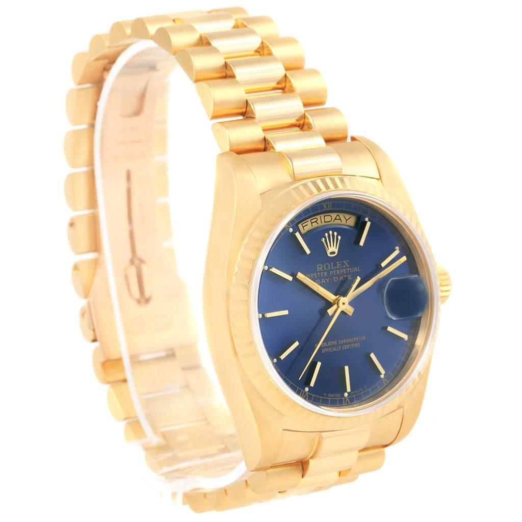 The image shows a Rolex President 18038 Men's Yellow Gold Blue Dial 18038 Men's Yellow Gold Blue Dial model from a 3/4 angle, highlighting the blue dial, gold case, and bracelet with a visible day and date display.