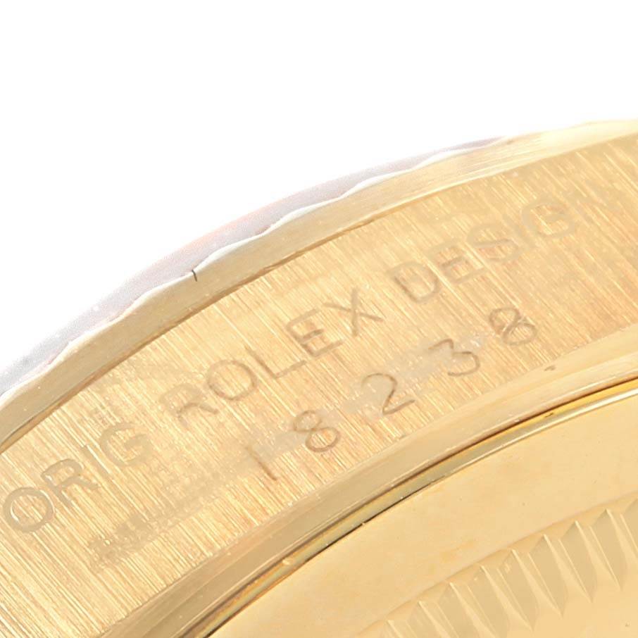 This close-up image shows the engraved details on the edge of the bezel of a Rolex President 18238 Men's Stainless Steel Champagne Dial 18238 Men's Stainless Steel Champagne Dial model watch.