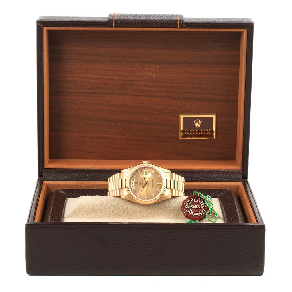 The Rolex President 18238 Men's Stainless Steel Champagne Dial 18238 Men's Stainless Steel Champagne Dial model watch is shown front-on in its opened case, along with a tag and a certification seal.