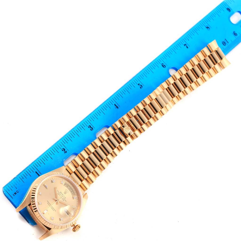 The image shows a Rolex President 18238 Men's Stainless Steel Champagne Dial 18238 Men's Stainless Steel Champagne Dial model watch laid flat with a blue ruler alongside it, highlighting the watch band.