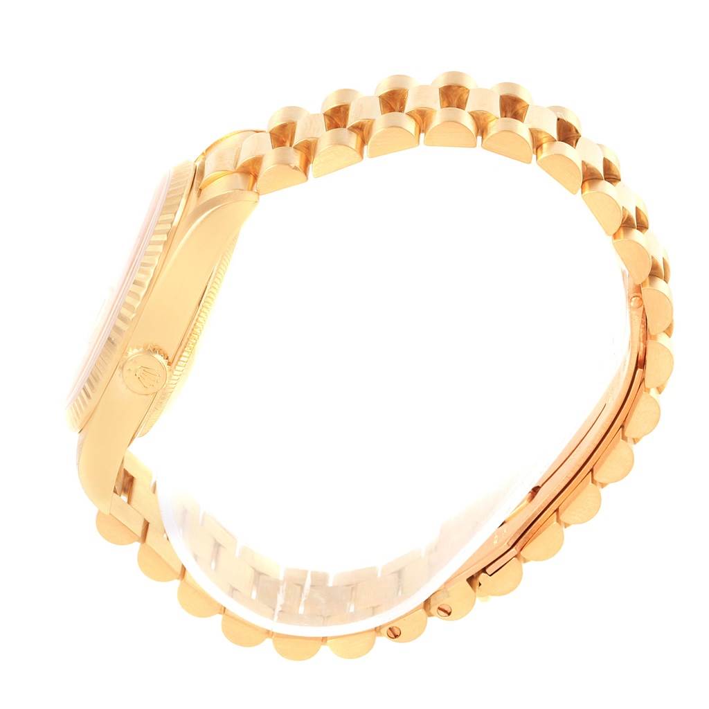 The image shows a side view of the Rolex President 18238 Men's Stainless Steel Champagne Dial 18238 Men's Stainless Steel Champagne Dial model watch, highlighting its case, crown, and gold bracelet.