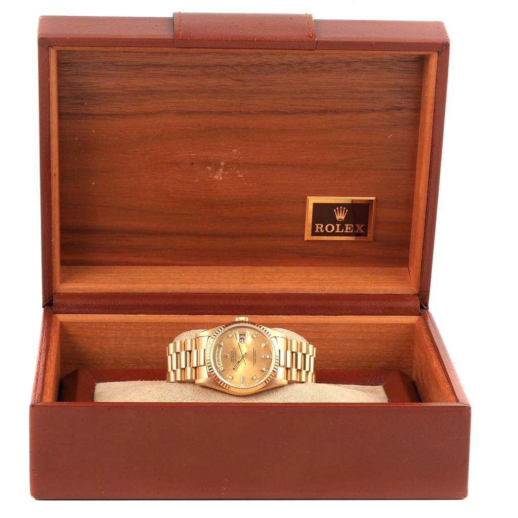 The Rolex President 17194 Men's Yellow Gold Champagne Dial 17194 Men's Yellow Gold Champagne Dial model watch is displayed inside an open wooden box, showing the face and bracelet.