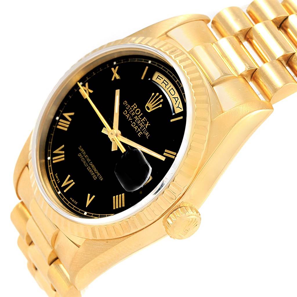 This image shows a close-up angled view of a Rolex President 18238 Men's Yellow Gold Black Dial 18238 Men's Yellow Gold Black Dial model watch, highlighting the face, crown, and part of the bracelet.