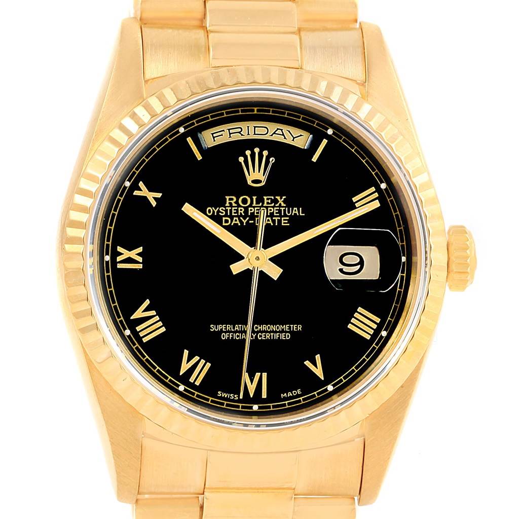This image shows a frontal view of a Rolex President 18238 Men's Yellow Gold Black Dial 18238 Men's Yellow Gold Black Dial model watch, featuring its black dial, gold Roman numeral markers, and day-date functions.
