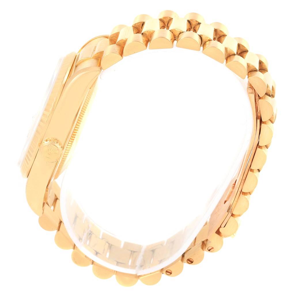 This image shows a side view of a Rolex President 18238 Men's Yellow Gold Black Dial 18238 Men's Yellow Gold Black Dial model watch, focusing on the case and bracelet.