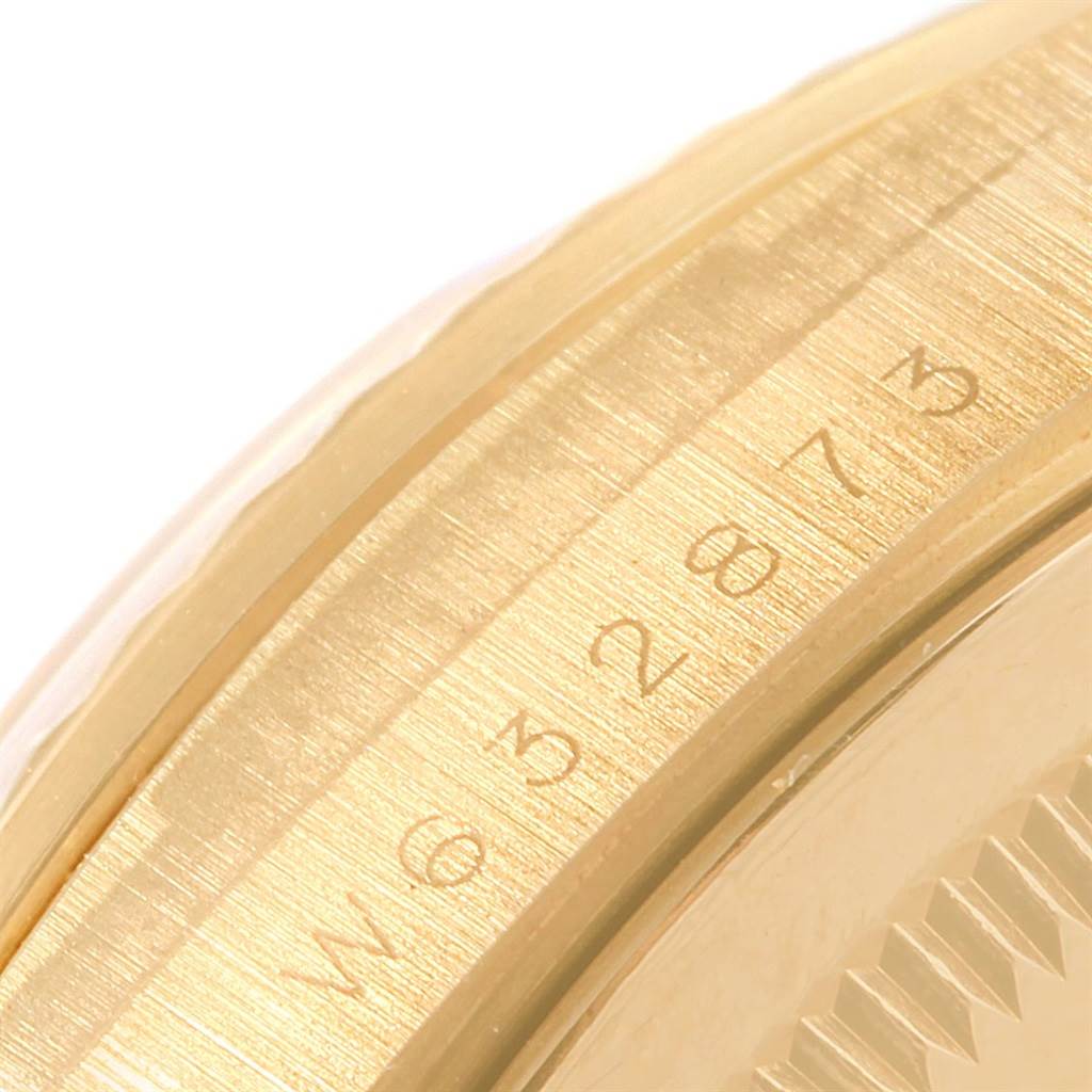 This close-up image shows the edge of the bezel and serial number on the President model by Rolex.
