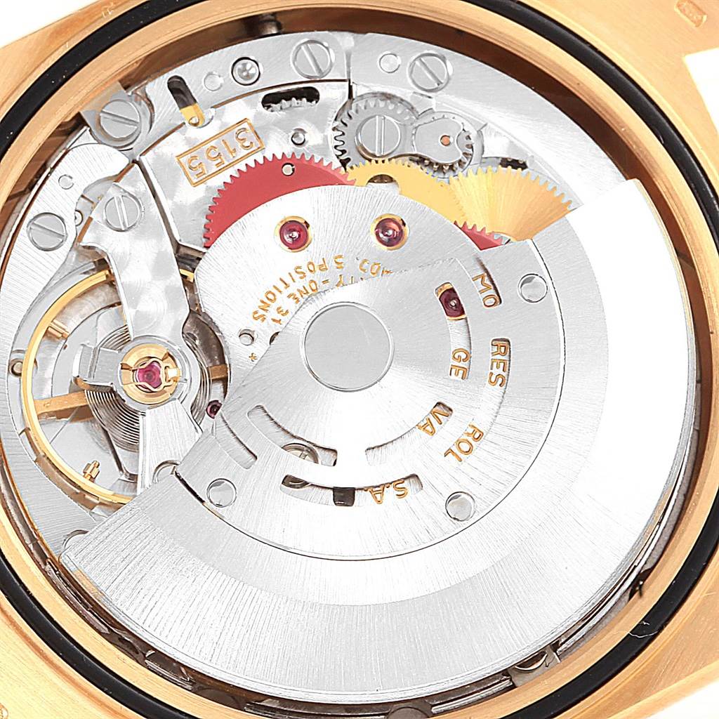 This image shows the intricate gears and movement parts of the Rolex President 18238 Men's Yellow Gold Champagne Dial 18238 Men's Yellow Gold Champagne Dial model watch from a close-up back angle.