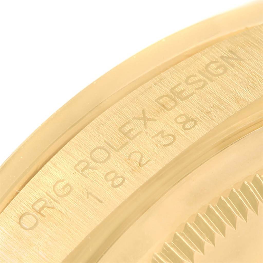 This image shows a close-up angle of the caseback engraving of a Rolex President 18238 Men's Yellow Gold Champagne Dial 18238 Men's Yellow Gold Champagne Dial model watch.