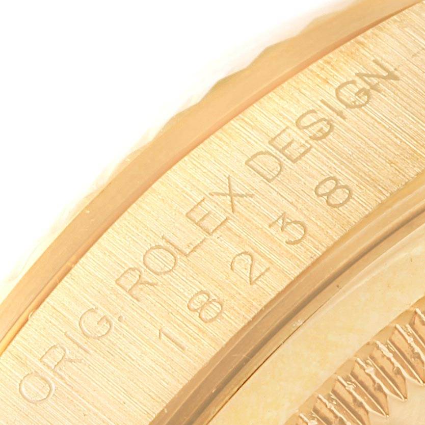This image shows a close-up of the engraved side with model designations on a Rolex President 18238 Men's Yellow Gold Brown Dial 18238 Men's Yellow Gold Brown Dial watch.