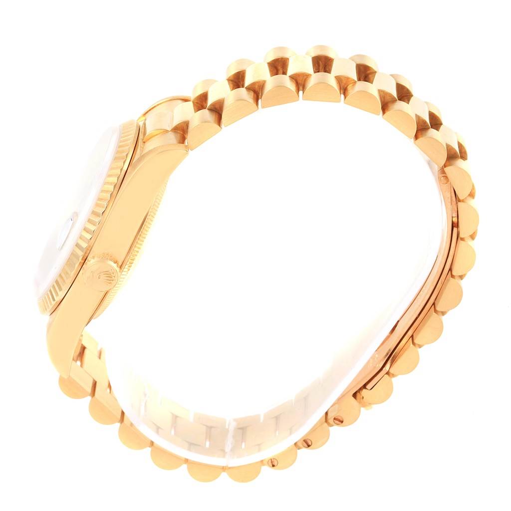 This image shows a side view of a Rolex President 18238 Men's Yellow Gold Brown Dial 18238 Men's Yellow Gold Brown Dial model watch focusing on its case and bracelet.