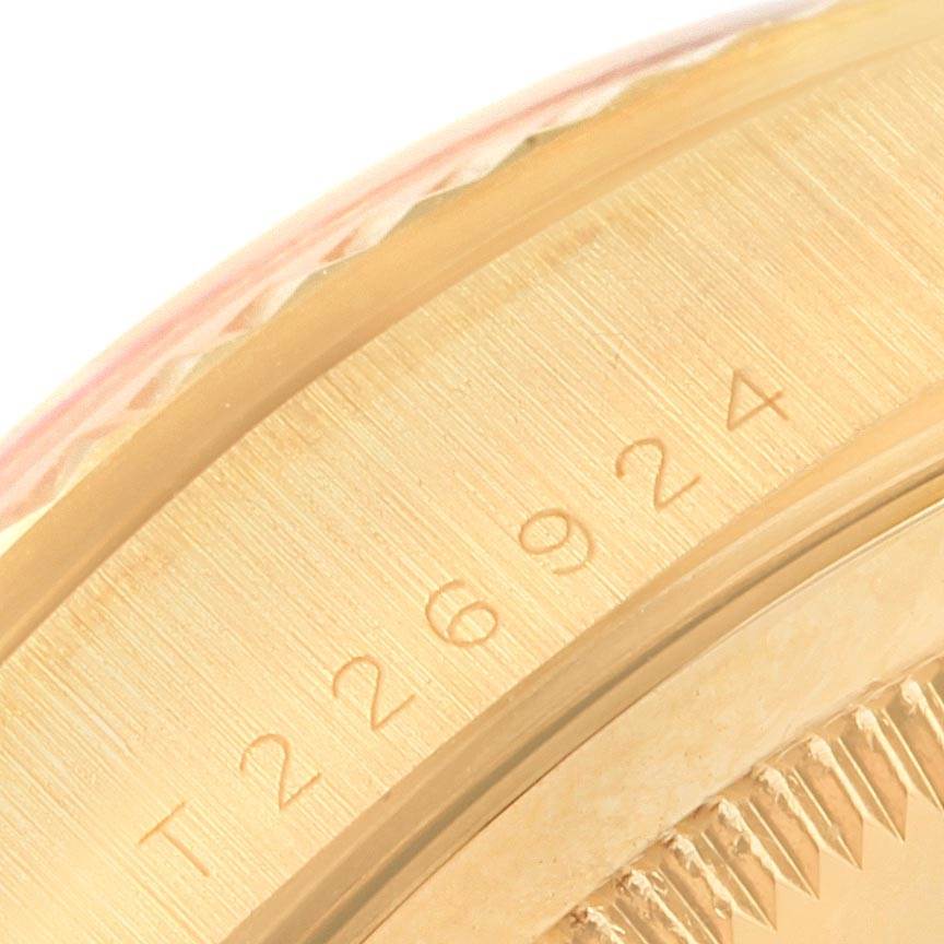 This image shows a close-up view of the side serial number engraving on a Rolex President 18238 Men's Yellow Gold Brown Dial 18238 Men's Yellow Gold Brown Dial watch case.