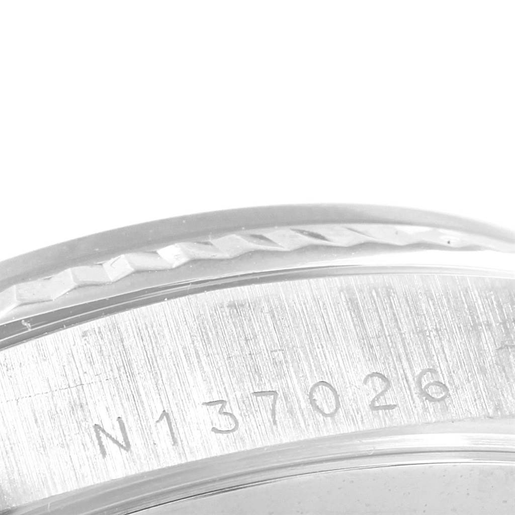 This is a close-up view of the outer rim and serial number engraving on a Rolex President 18239 Men's White Gold Silver Dial 18239 Men's White Gold Silver Dial model watch.