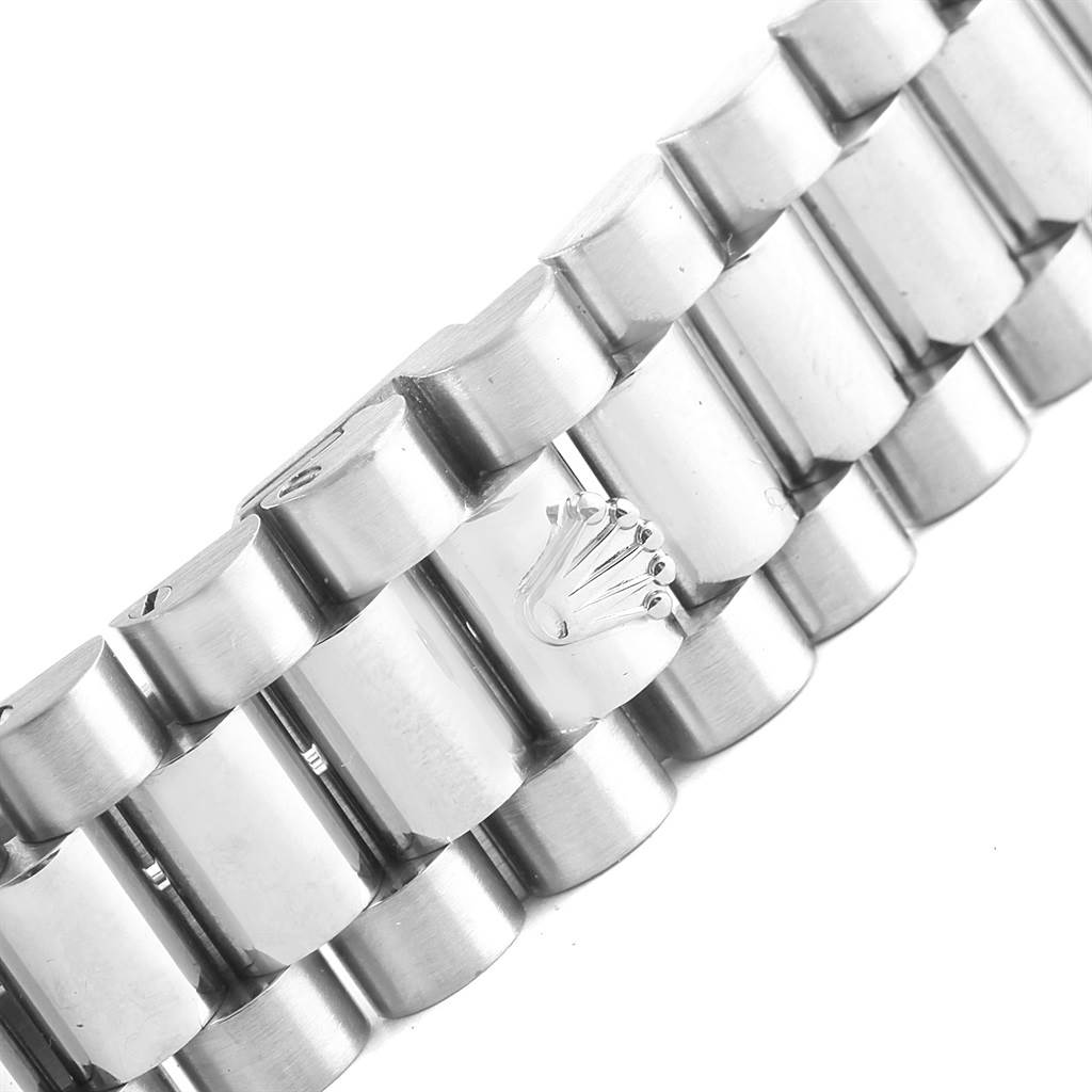 This close-up shows a part of the bracelet with the Rolex crown logo of the President model by Rolex.