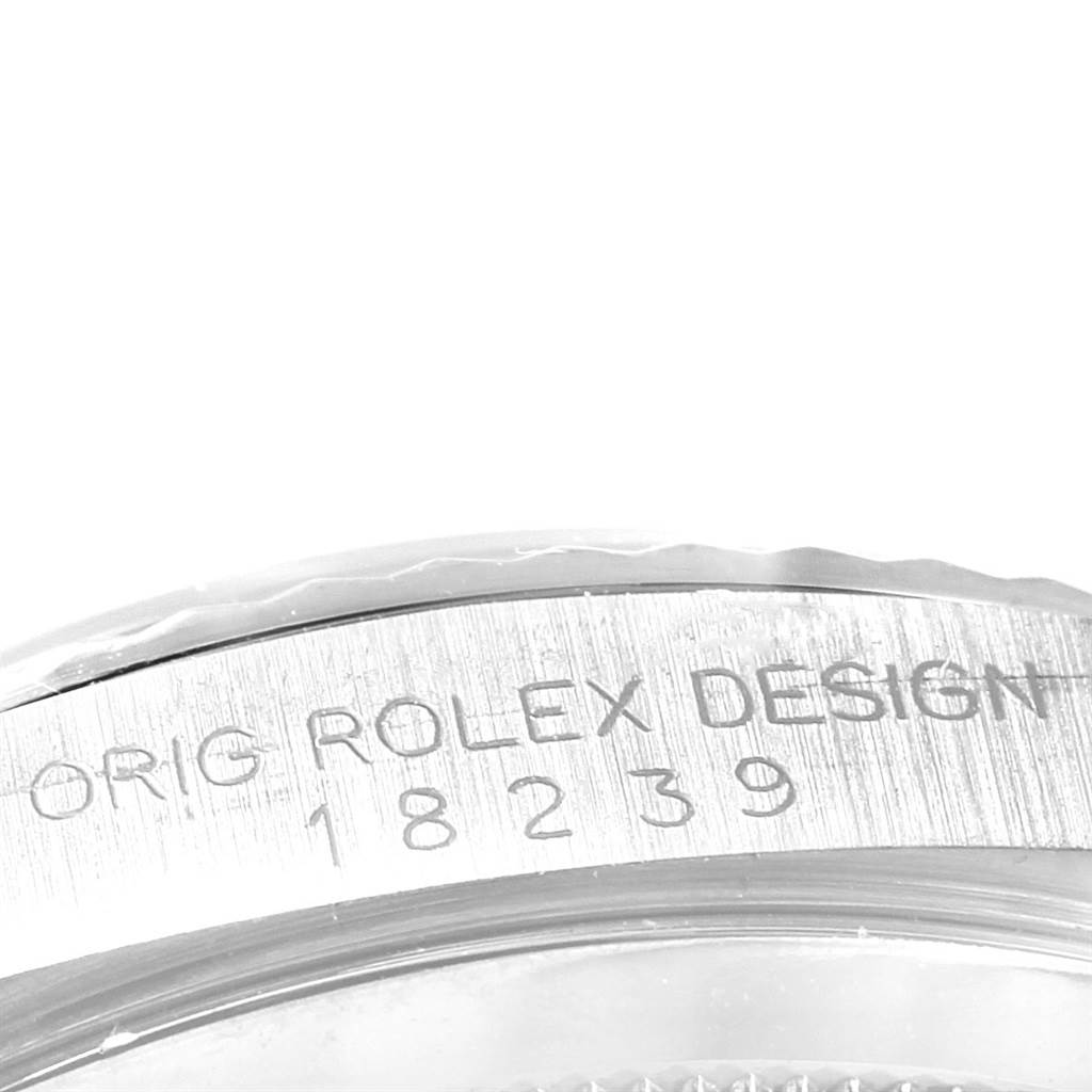 The image shows a close-up of the engraved side of the bezel of a Rolex President 18239 Men's White Gold Silver Dial 18239 Men's White Gold Silver Dial model watch.