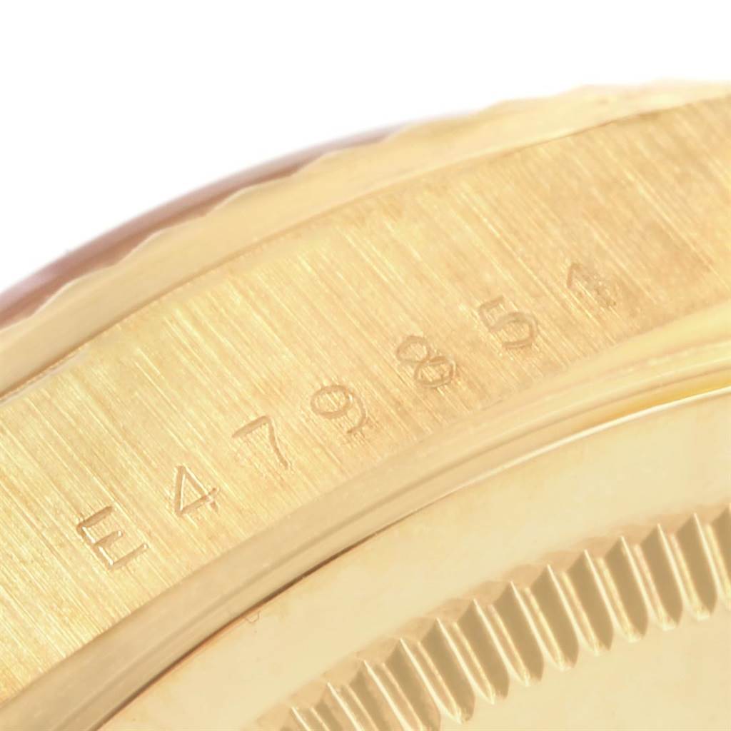 The image shows a close-up of the serial number engraved on the side of the Rolex President 18238 Men's Yellow Gold Champagne Dial 18238 Men's Yellow Gold Champagne Dial watch case.