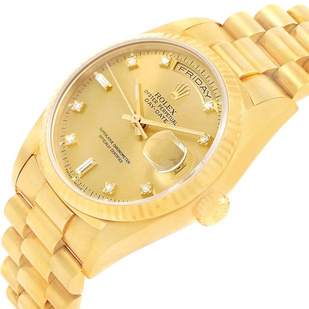The image shows a close-up, angled view of the Rolex President 18238 Men's Yellow Gold Champagne Dial 18238 Men's Yellow Gold Champagne Dial model watch, featuring its gold dial, diamond hour markers, and bracelet.