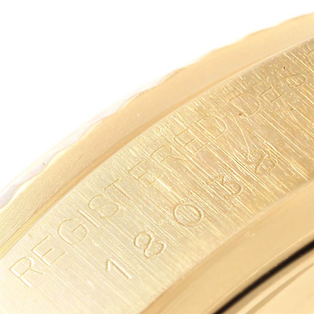 This image shows a close-up of the engraved serial number "1803" on the bezel of a Rolex President 18038 Men's Yellow Gold White Dial 18038 Men's Yellow Gold White Dial model watch.