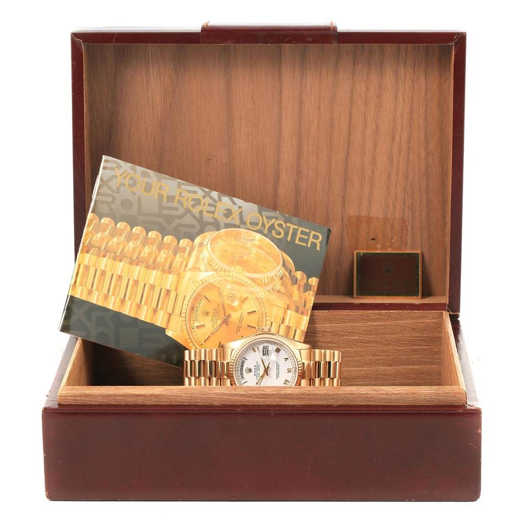 The image shows a Rolex President 18038 Men's Yellow Gold White Dial 18038 Men's Yellow Gold White Dial model watch in its case, along with accompanying paperwork.