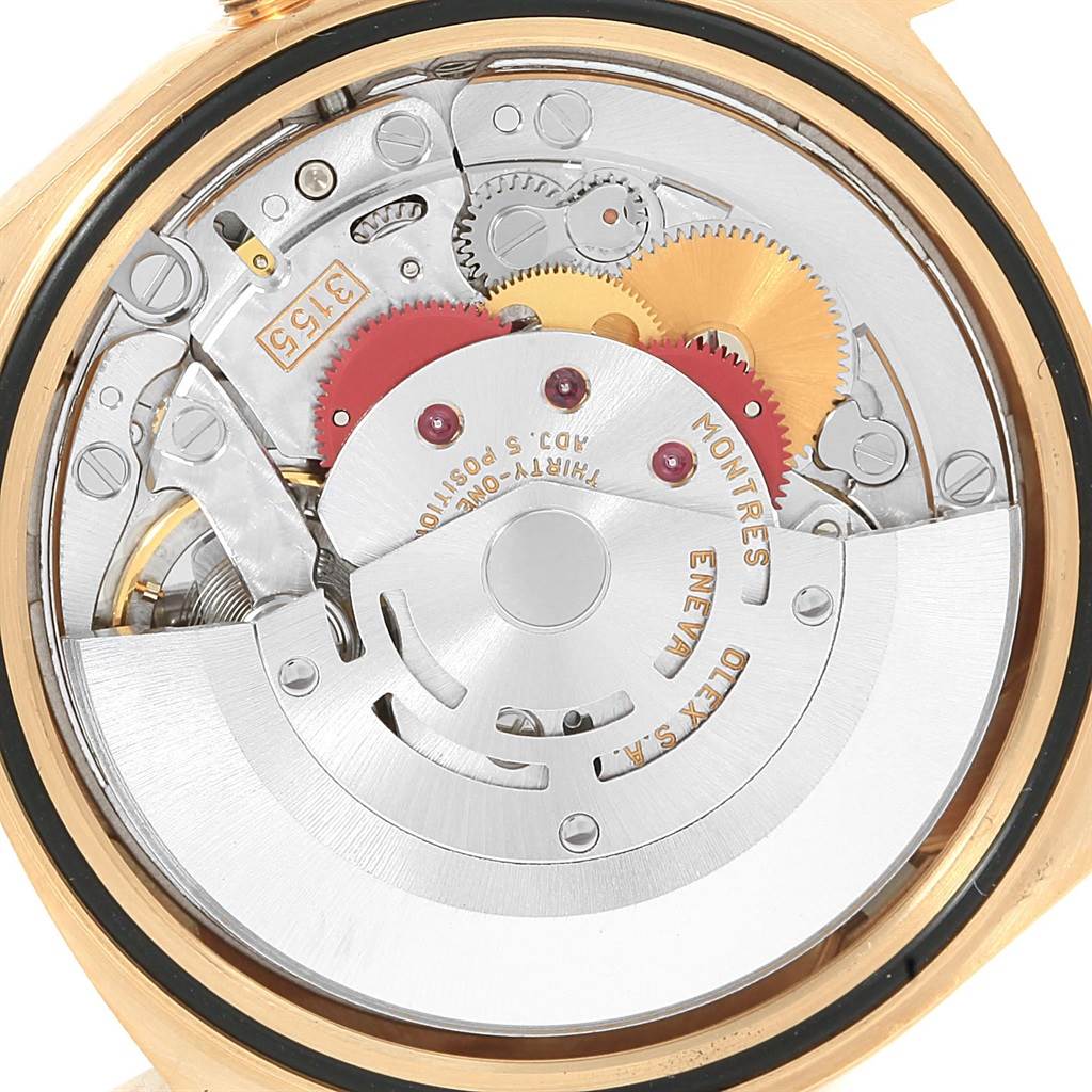 This image shows the internal mechanical movement of the Rolex President 18238 Men's Yellow Gold Champagne Dial 18238 Men's Yellow Gold Champagne Dial model watch, highlighting gears and the rotor.