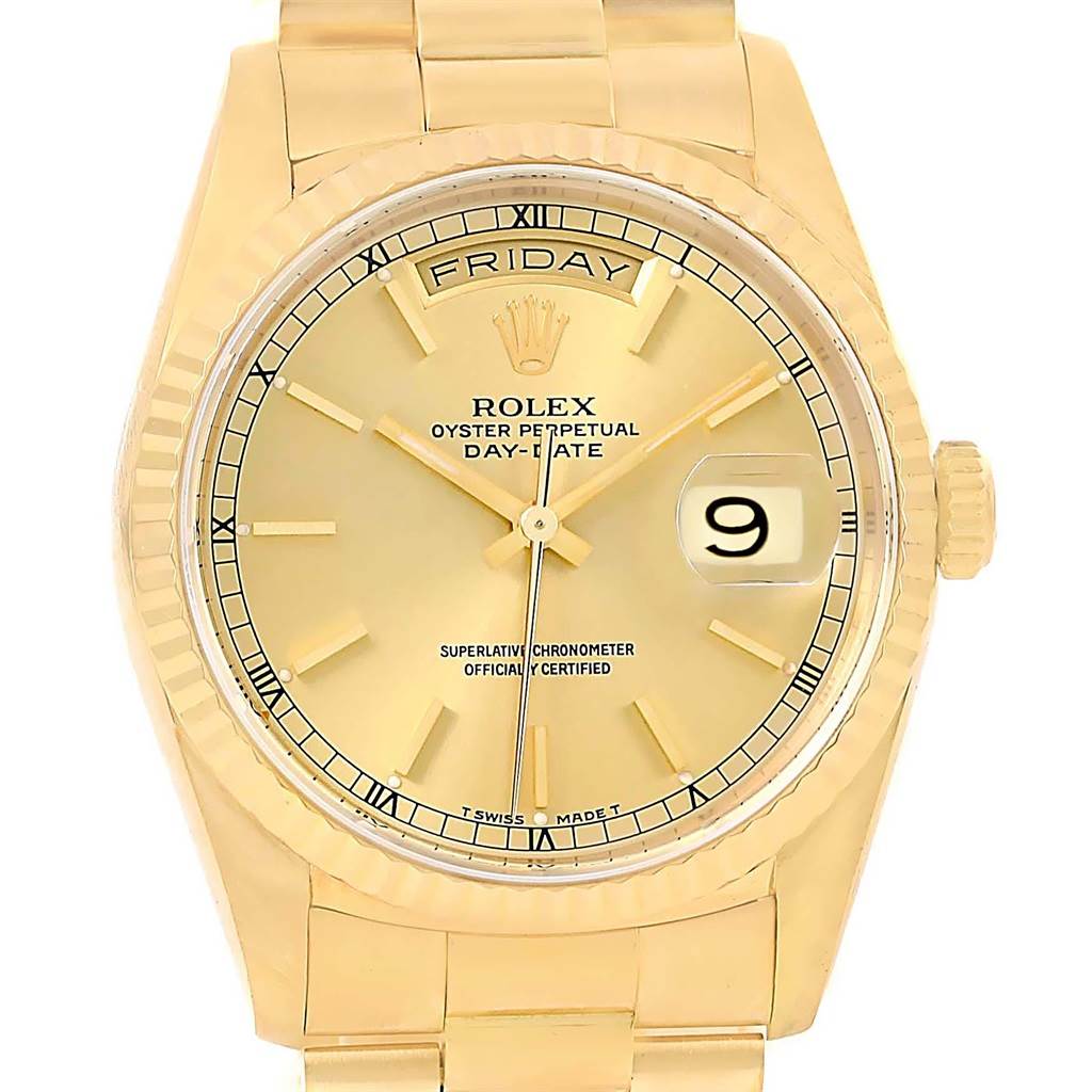 This is a close-up, front-angle view of a Rolex President 18238 Men's Yellow Gold Champagne Dial 18238 Men's Yellow Gold Champagne Dial model watch, showing the dial, bezel, and part of the bracelet.